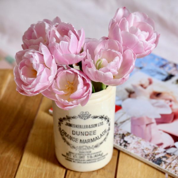 The Weekend Edit: reading a magazine in bed with tulips
